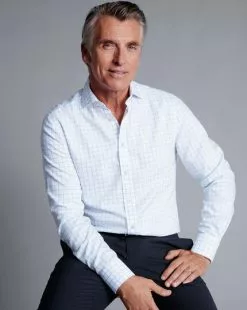 CHARLES TYRWHITT Spread Collar Non-Iron Henley Weave Shirt - Cornflower B -Charles Tyrwhitt Shop FON2482CFW MODEL SEATED