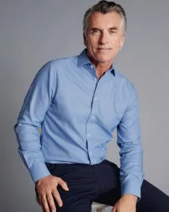 CHARLES TYRWHITT Spread Collar Non-Iron Henley Weave Shirt - Ocean B -Charles Tyrwhitt Shop FON2482OCE MODEL SEATED