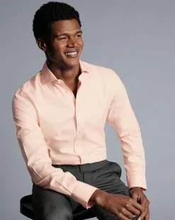 CHARLES TYRWHITT Spread Collar Non-Iron Henley Weave Shirt - Peach -Charles Tyrwhitt Shop FON2482PCH MODEL SEATED