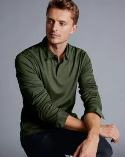 CHARLES TYRWHITT Smart Long Sleeve Jersey Polo - Olive Green -Charles Tyrwhitt Shop JEP0326OLV MODEL SEATED