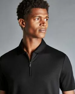 CHARLES TYRWHITT Zip-Neck Jersey Polo - Black -Charles Tyrwhitt Shop JEP0378BLK MODEL DETAIL
