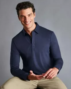 CHARLES TYRWHITT Cotton TENCEL™ Mix Long Sleeve Polo - Indigo B -Charles Tyrwhitt Shop JEP0389NAV MODEL SEATED